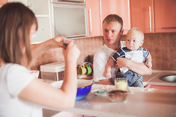 Image showing Happy family cooking at kitchen