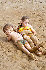 Image showing Two girls in the sand