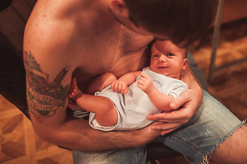 Image showing Newborn baby in father hands