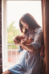 Image showing Young mother with baby