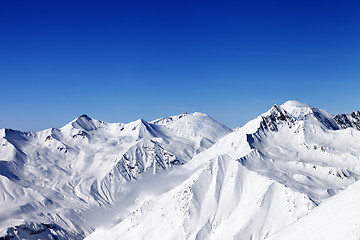 Image showing Snowy mountains in sun day