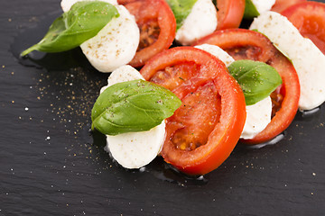 Image showing Caprese salad with mozzarella, tomato, basil and balsamic vinega