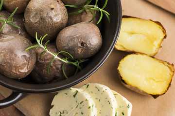 Image showing  baked potatoes with herbs butter