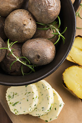 Image showing  baked potatoes with herbs butter