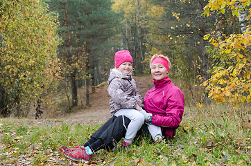 Image showing Grandmother with her granddaughter in the autumn park