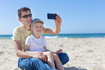 Image showing family taking selfie at the beach