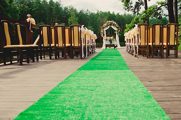 Image showing Wedding ceremony in a beautiful garden.