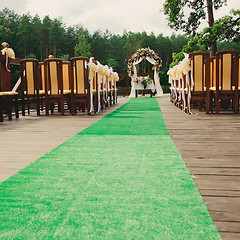 Image showing Wedding ceremony in a beautiful garden.