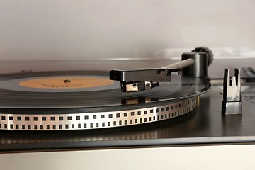 Image showing old gramophone turntable with disc