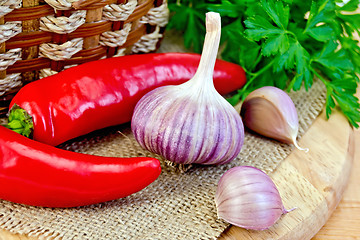 Image showing Garlic with spicy red pepper on board