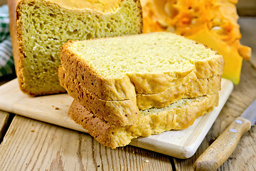 Image showing Bread pumpkin homemade with knife on wooden board