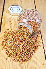 Image showing Buckwheat in glass jar and on board