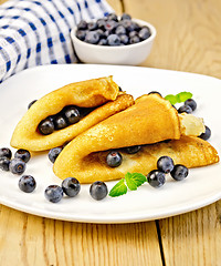 Image showing Pancakes with blueberries on board