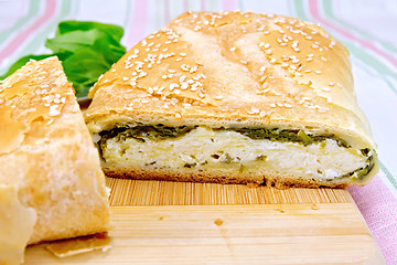 Image showing Roll filled with spinach and cheese on cloth