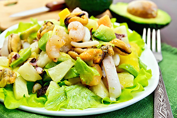 Image showing Salad seafood and avocado on napkin