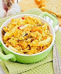 Image showing Pilaf with seafood and bread on napkin