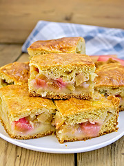 Image showing Pie rhubarb in plate and napkin on board