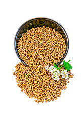 Image showing Buckwheat in brown bowl with flower