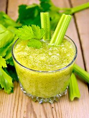 Image showing Cocktail with celery in low glassful on board