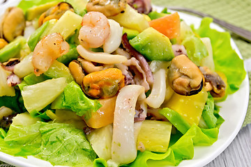Image showing Salad seafood and lettuce on light board