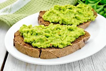 Image showing Sandwich with guacamole on light board