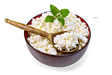 Image showing Curd in wooden bowl with spoon