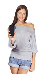 Image showing Young woman showing mobile cell phone