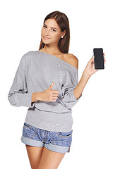 Image showing Young woman showing mobile cell phone