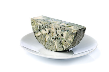 Image showing Cheese with mold on the plate. Isolate on white.