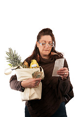 Image showing Grocery Shopper Reviewing Receipt