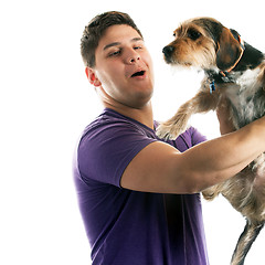 Image showing Man Holding His Pet Dog