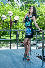 Image showing Beautiful young girl over city park background