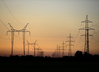 Image showing Large transmission towers at sunset