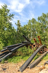 Image showing Rusty metal pipes in the forest