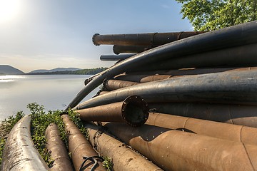 Image showing Rusty metal pipes in the forest