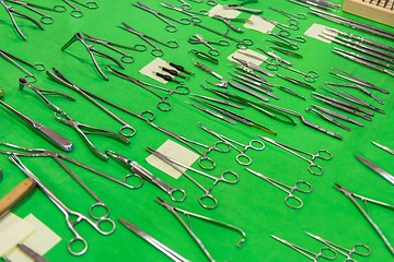 Image showing Medical instruments collection on green textile