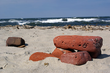 Image showing Red bricks on the beach