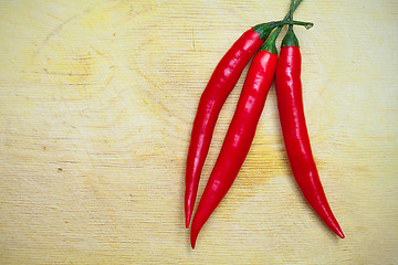 Image showing three red hot chili peppers