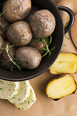 Image showing  baked potatoes with herbs butter