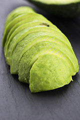 Image showing ripe cleaned peeled avocado sliced
