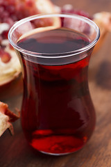 Image showing Ripe pomegranates with juice on table