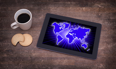 Image showing World map on a tablet