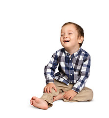 Image showing Cute boy siting on the floor