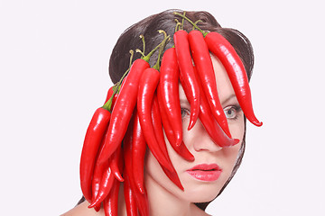 Image showing Pretty Face Covered with Hot Chili Pepper