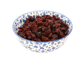 Image showing Dried cranberries in a blue and white china bowl