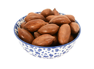 Image showing Pecan nuts in a blue and white china bowl