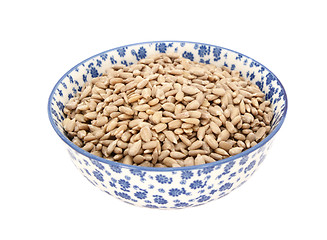 Image showing Sunflower seed hearts in a blue and white china bowl