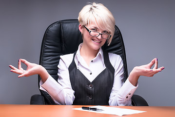 Image showing Blond businesswoman meditating