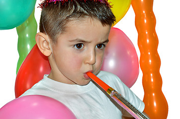 Image showing Happy boy play with air whistle