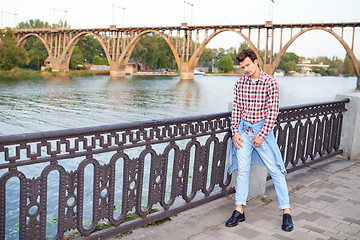 Image showing Handsome man outdoors over urban background